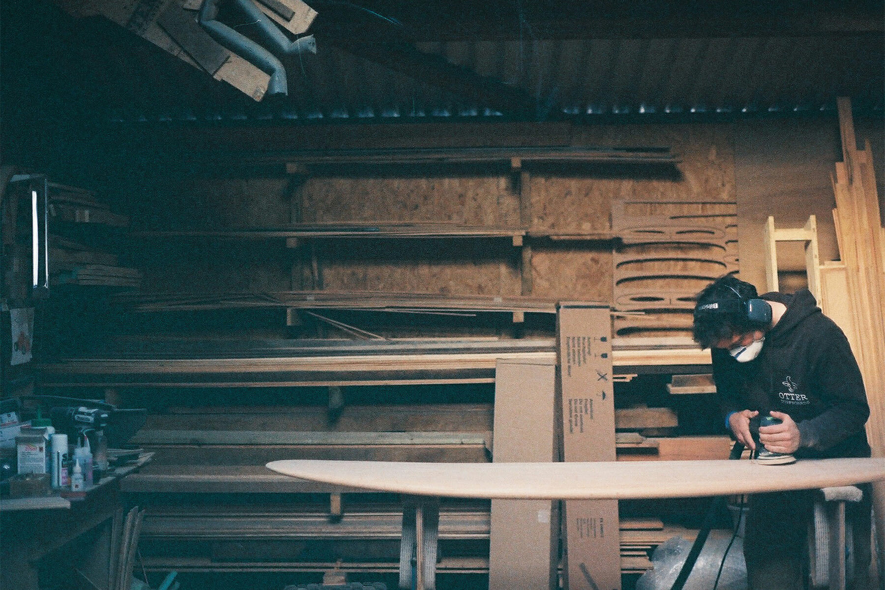 James Otter wooden surfboard National Trust at Trelissick Cornwall Board being sanded