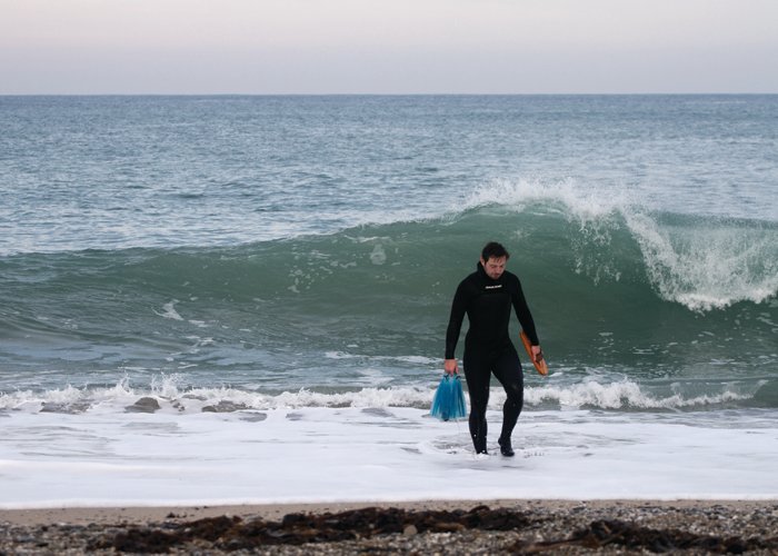 james otter shorey exit with wooden bodysurfing handplane