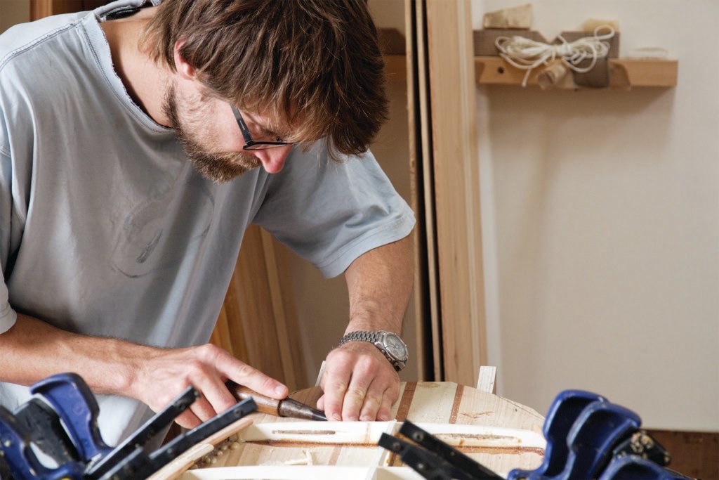 Helen and Duncan otter wooden surfboard workshop cornwall july 2014 duncan chiseling nose
