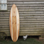 finished wooden surfboard deck otter surfboards workshop cornwall cutter