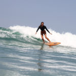Sarah enjoys a wave on the Fetch at Chapel Porth, Cornwall. Otter Wooden surfboard