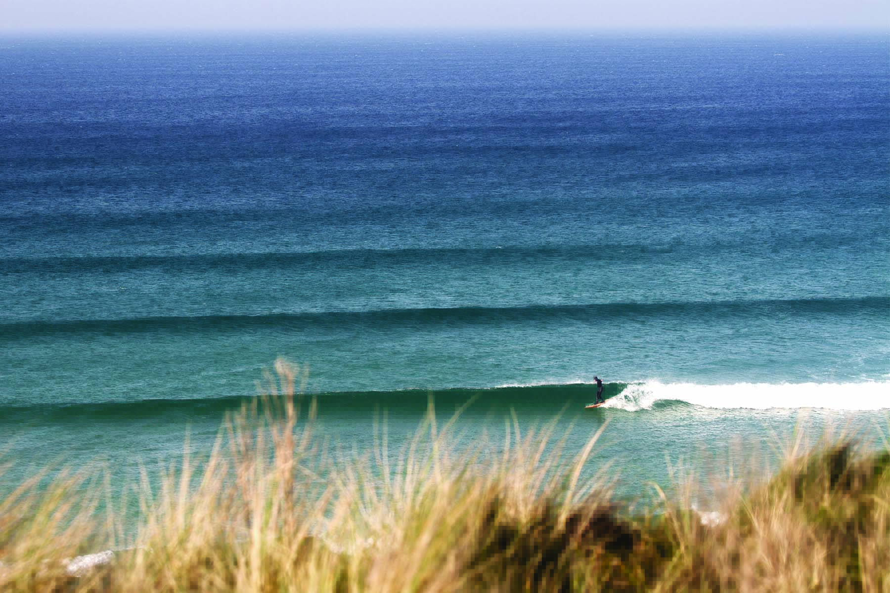 Mat Arney surfing the Otter Surfboards wooden Pier in mid-winter at Gwithian
