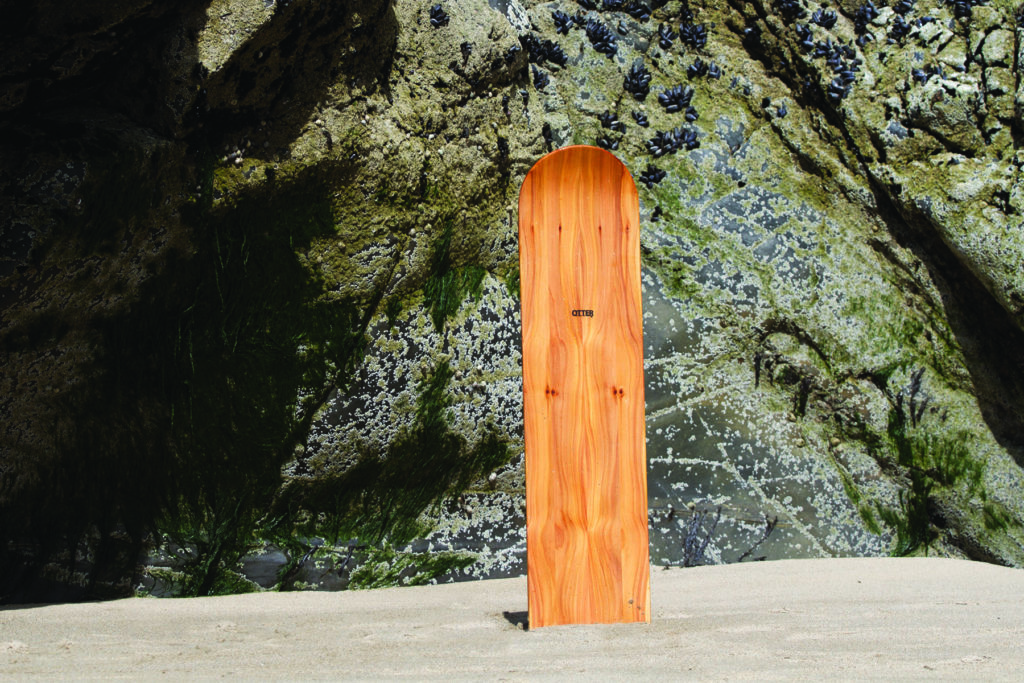 otter wooden bellyboard plain cedar on the beach by the rocks