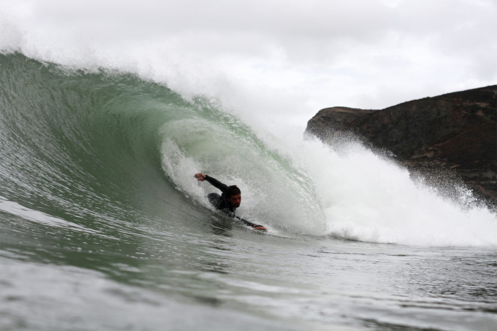 Chris bodysurf barrel at Aggie