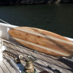finished wooden surfboard deck otter surfboards workshop cornwall cutter on a pilot cutter boat hesper