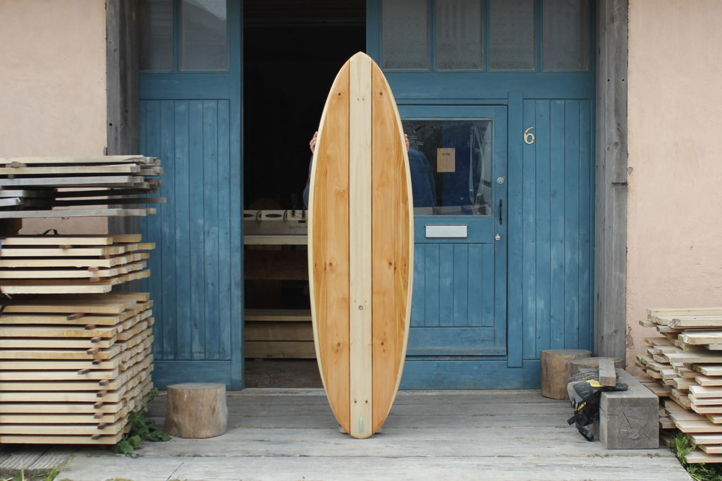finished wooden surfboard deck otter surfboards workshop cornwall cutter