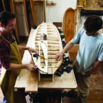 Otter Surfboards wooden surfboard workshop course in Cornwall Duncan talking fin positions on his Barque