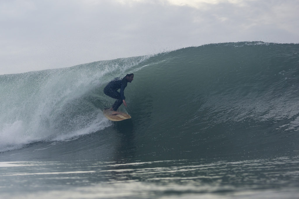 Jake boex ceramice barrelled at porthleven on an otter wooden surfboard