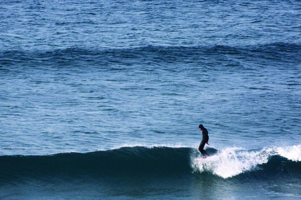 Mat Arney surfing the Otter Surfboards wooden Pier in mid-winter at Gwithian