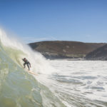 Matt Smith tucking under the lip on an Otter wooden surfboard coaster at St Agnes, Cornwall