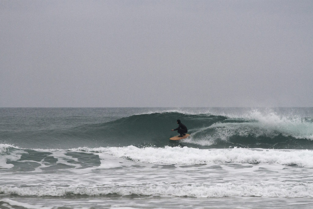 Seadar James Otter Surfing wooden surfboard at Porthtowan