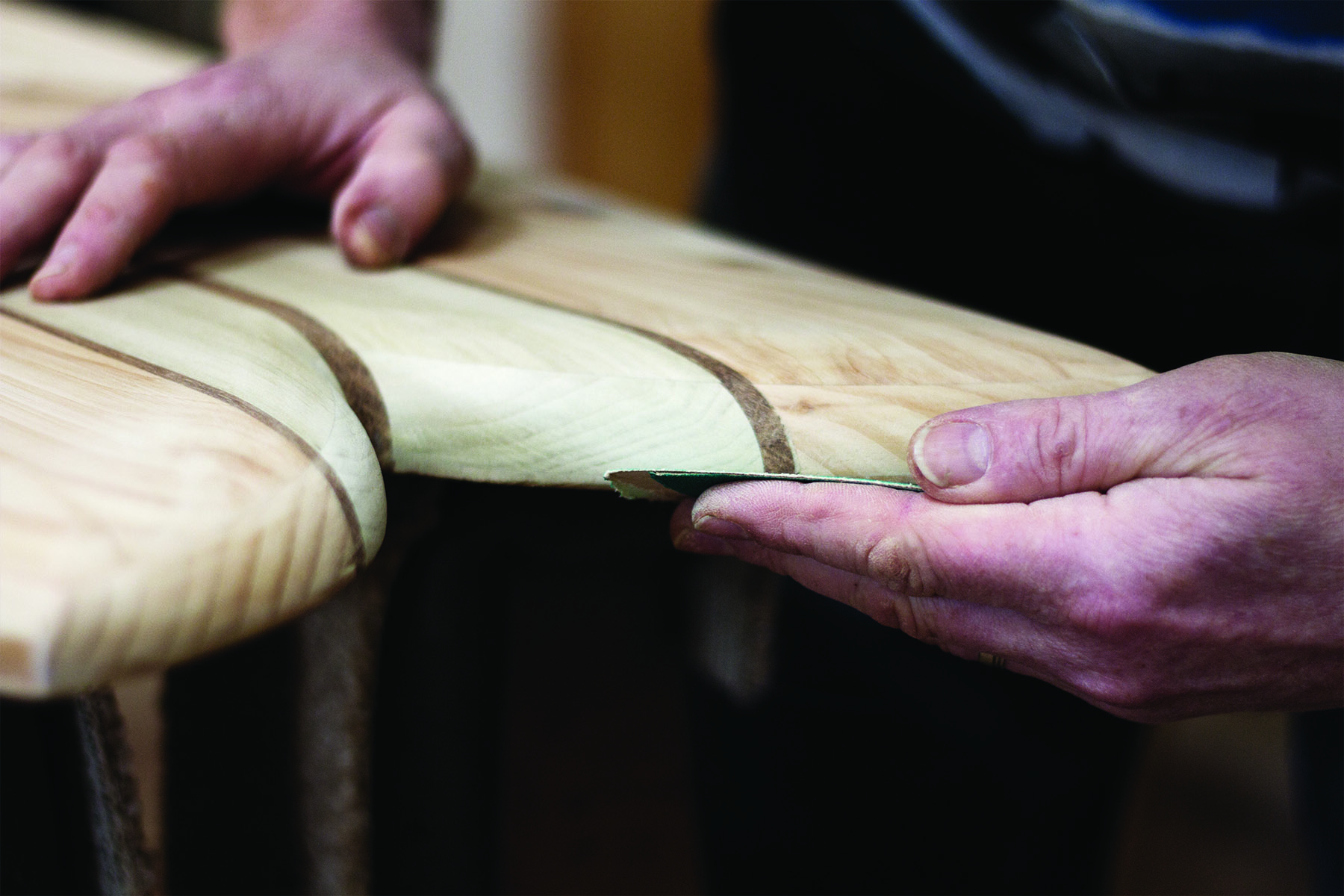 Otter Surfboards wooden surfboard workshop course in Cornwall Lloyd fish tail sanding detail