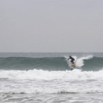Seadar James Otter Surfing wooden surfboard at Porthtowan dropping in