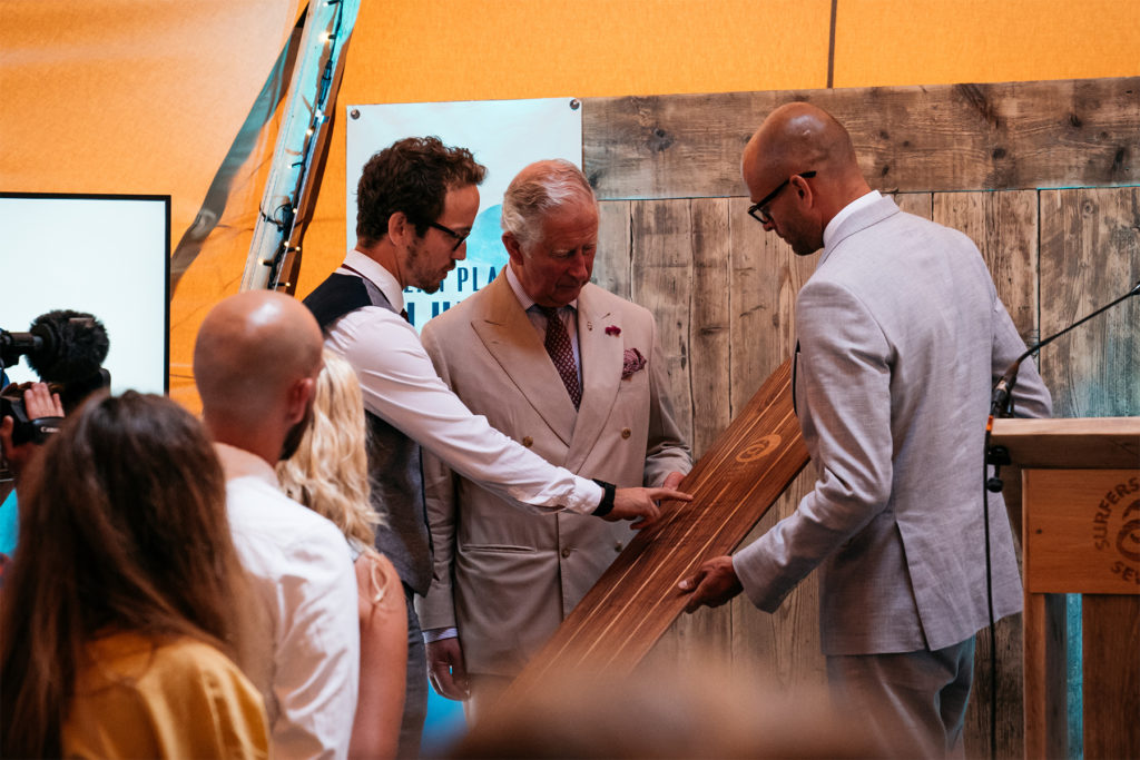 HRH Prince of Wales Duke of Cornwall Prince Charles Hugo Tagholm and James Otter ocean plastic solutions day 2018 Woden Bellyboard gift otter surfboards surfers against sewage