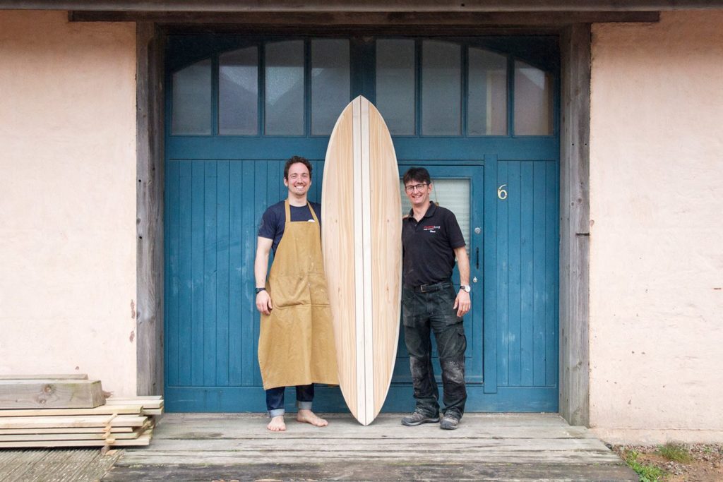 Otter wooden surfboard workshop blue doors