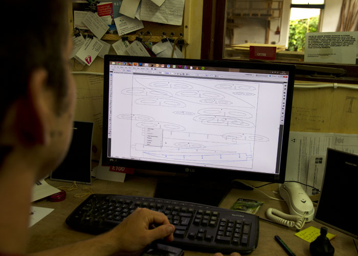James Otter designing framework for ben skinner sas wooden surfboard gun