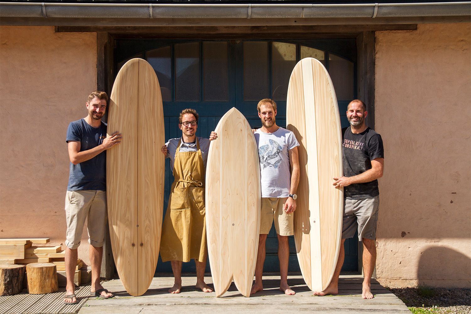 Otter wooden surfboard workshop blue doors