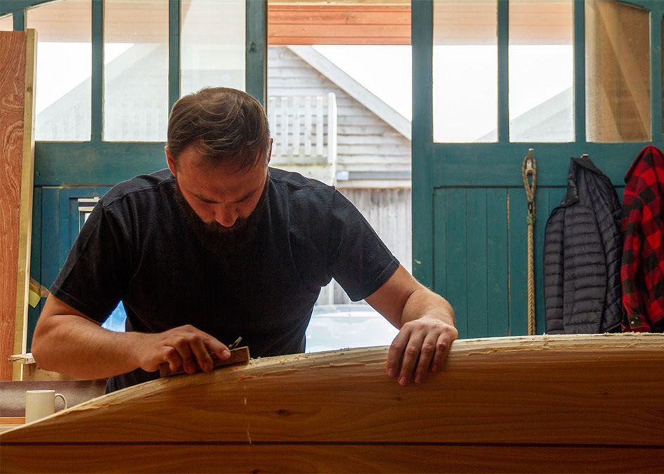 Workshop wooden surfboard planing