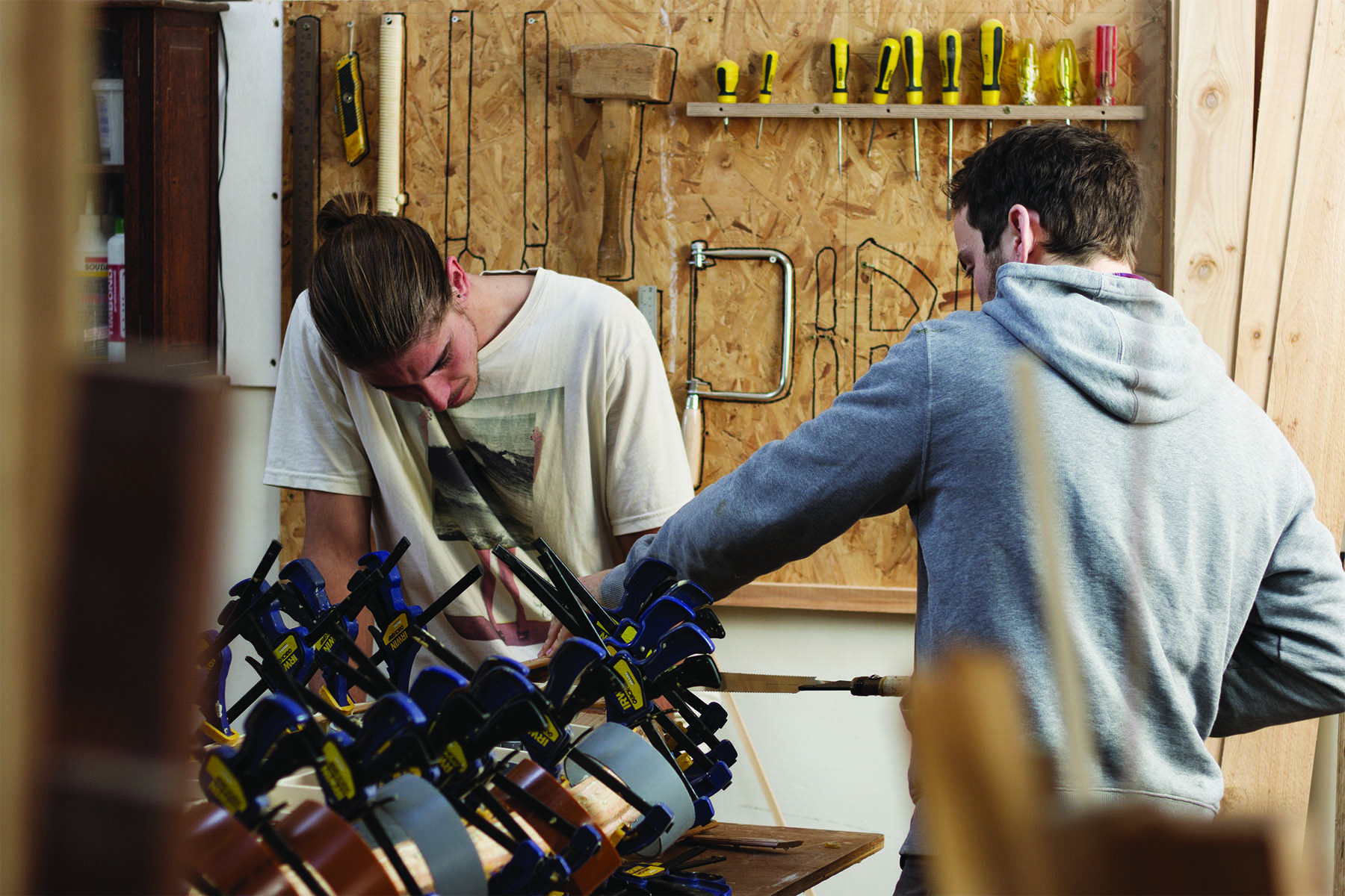 Claudio Pete and Patrick making wooden surfboards in the otter workshop james and claudio