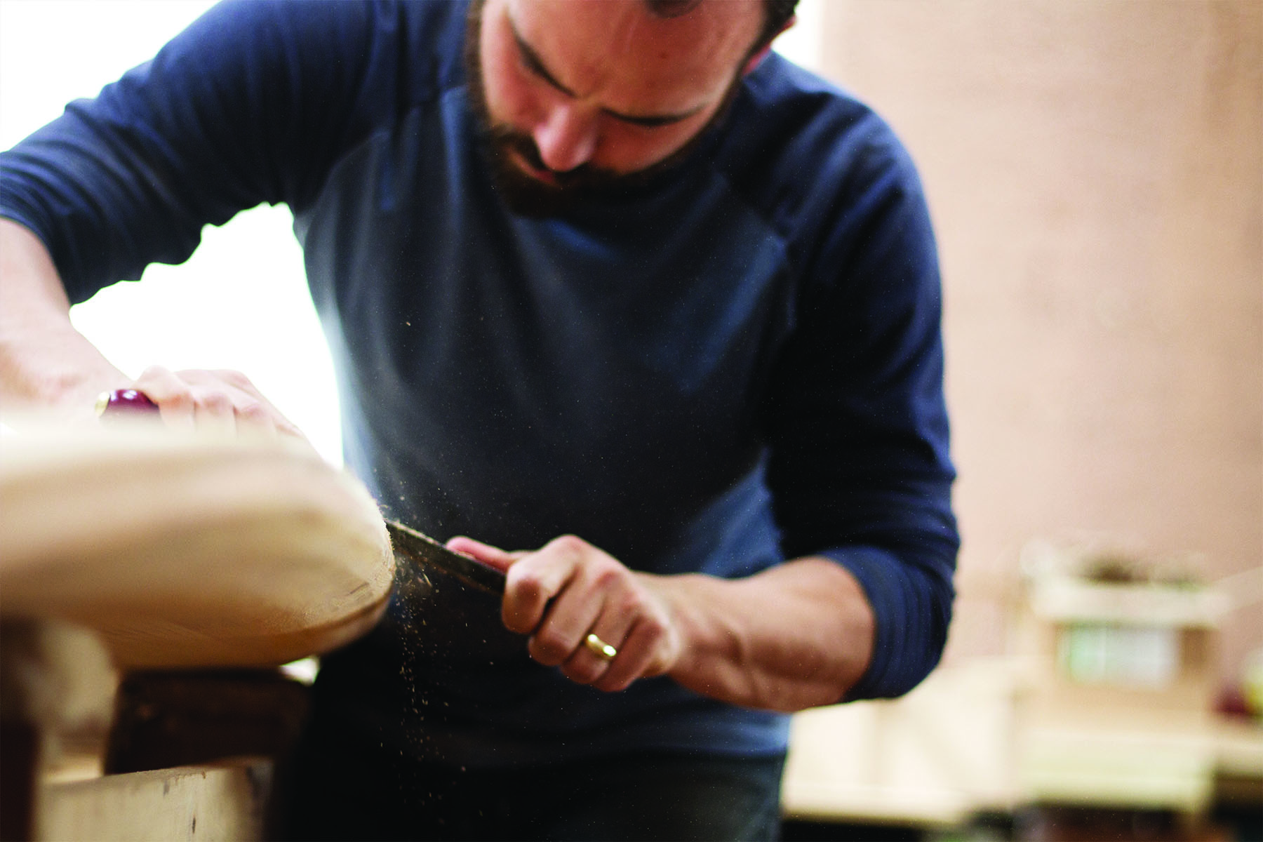 Kim and Shelby wooden surfboard making in the otter workshop in cornwall kim rasping rails