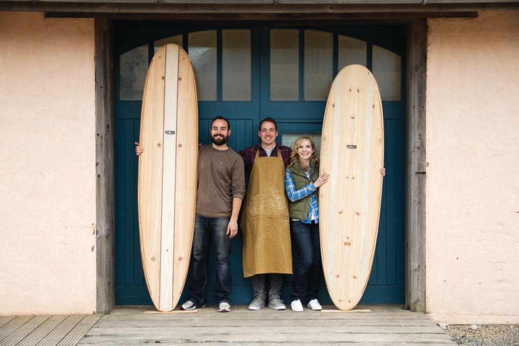 Kim and Shelby wooden surfboard making in the otter workshop in cornwall portrait with james