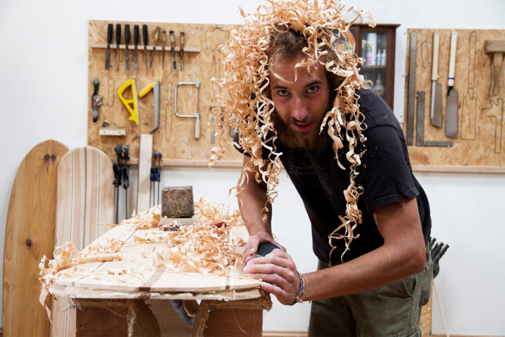 Luca otter wooden surfboard workshop cornwall july 2014 shavings in hair