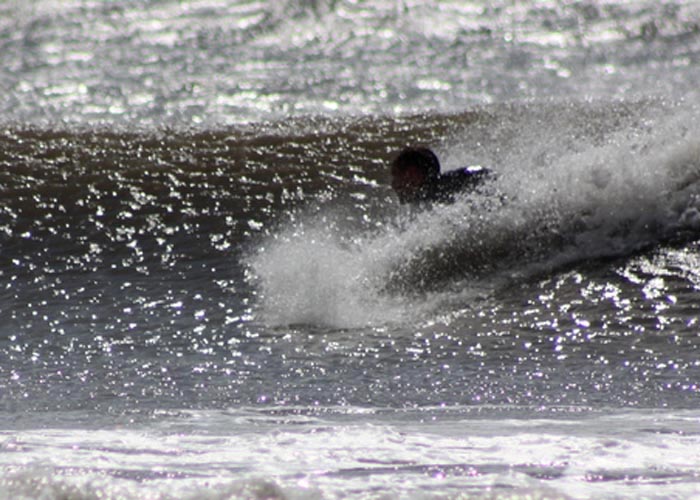 otter wooden bodysurf handplane pebble leigh in the waves