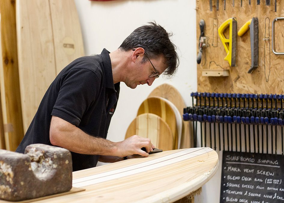 Otter wooden surfboard workshop shaping