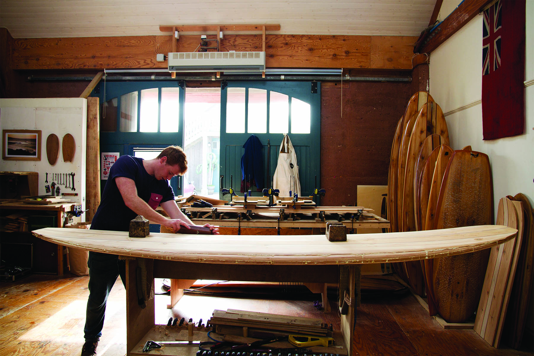 Ralph otter wooden surfboard workshop cornwall september 2014 raplh planing in the workshop