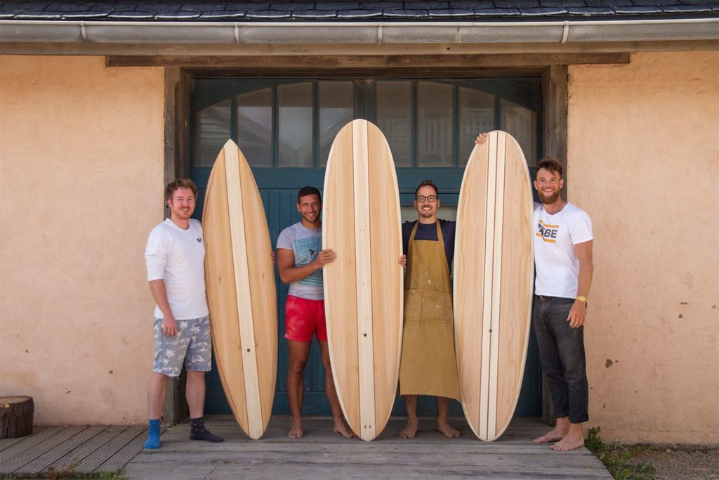 otter wooden surfboard workshop blue doors