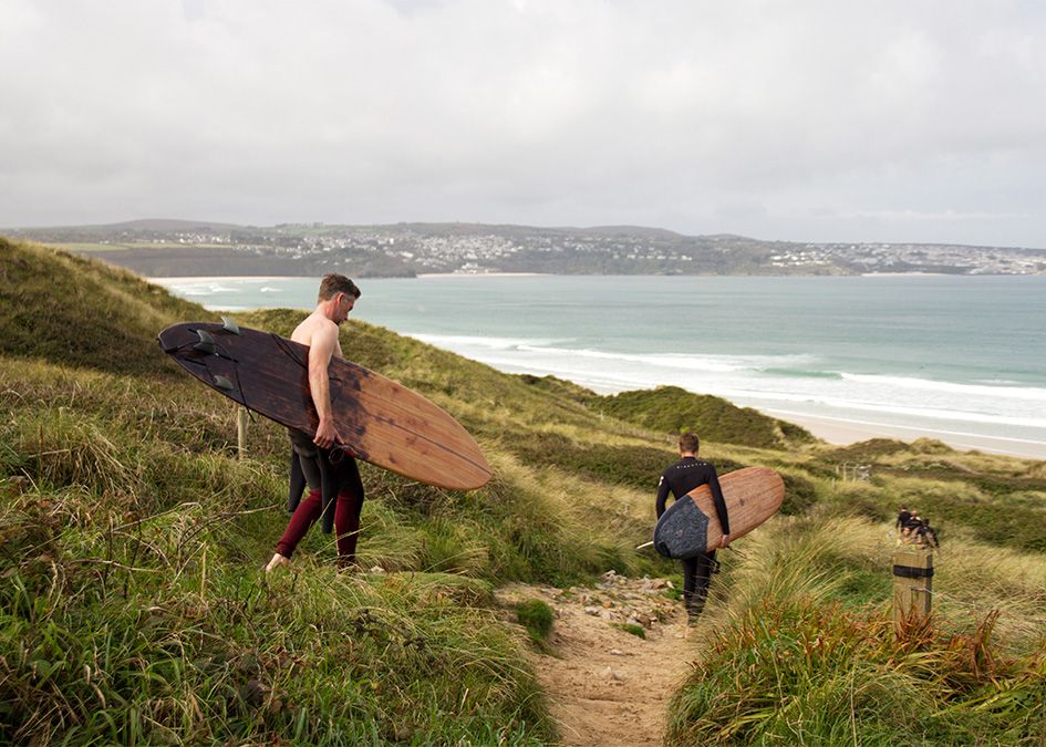 Otter wooden surfboard beach walk