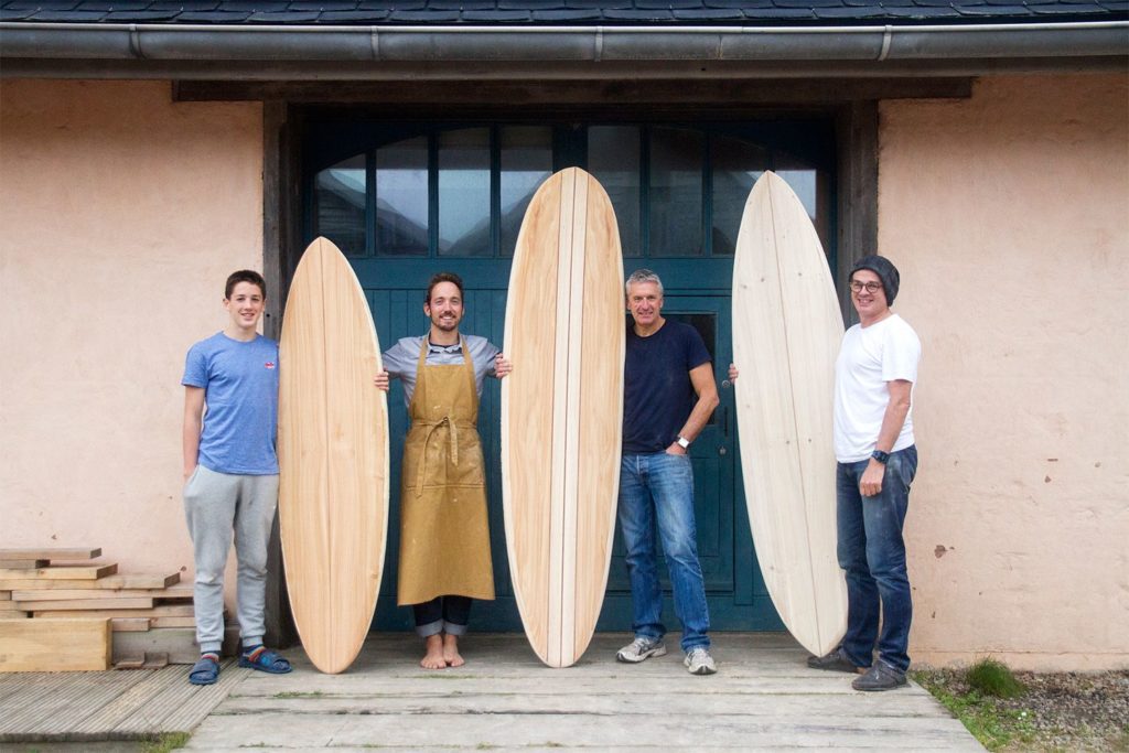Otter wooden surfboard workshop blue doors