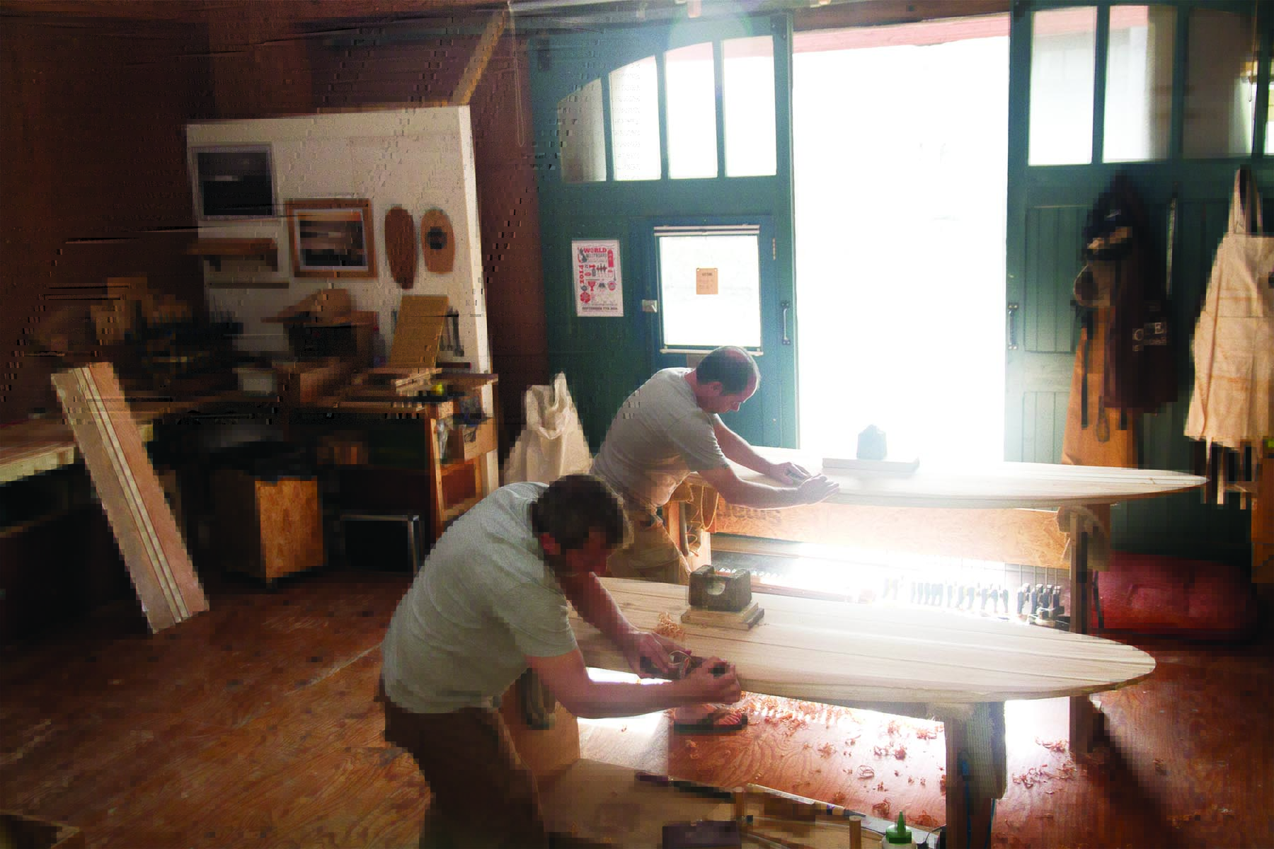 ben and kelvin otter wooden surfboard workshop cornwall 2014 planing in the sunlight