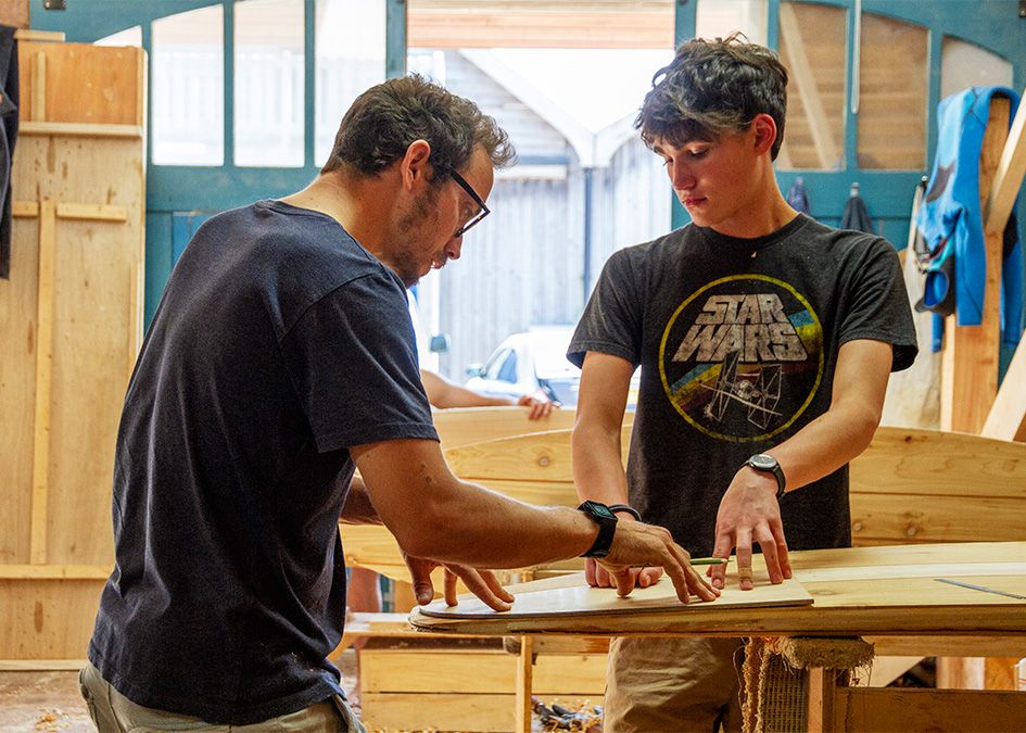 Otter wooden surfboard workshop shaping
