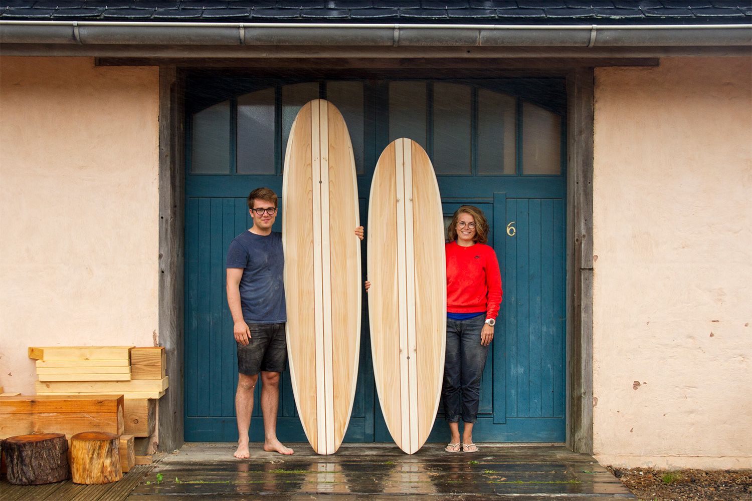 Otter wooden surfboard workshop blue doors