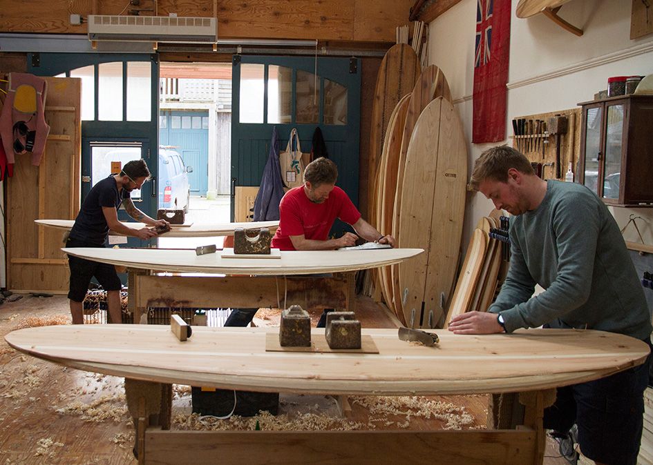 Otter wooden surfboard workshop shaping