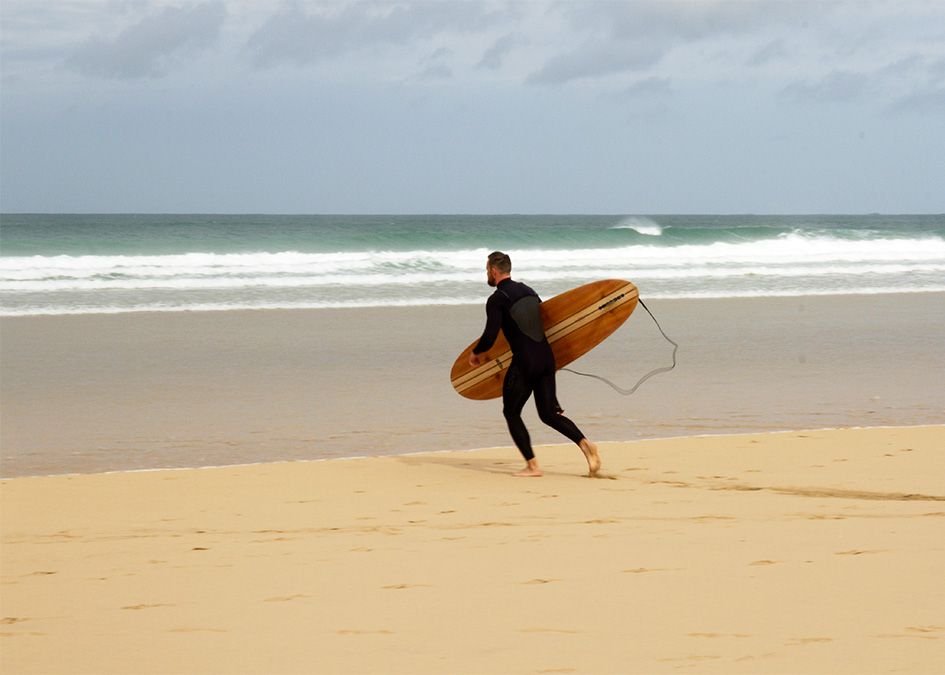 Otter wooden surfboard beach surfer run