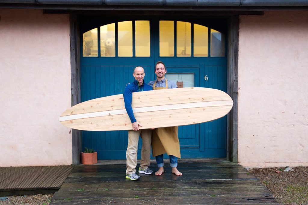 Otter wooden surfboard workshop blue doors