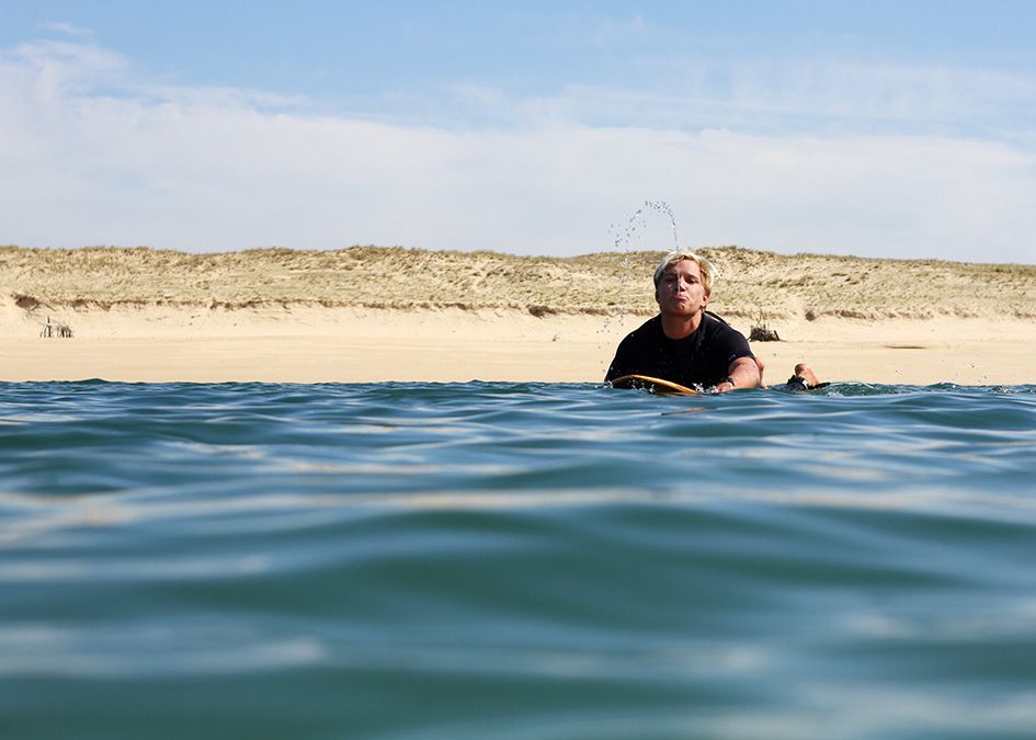 surfer paddling