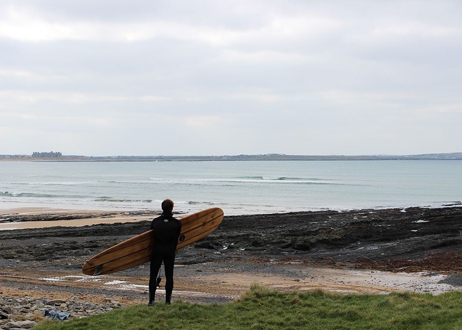 Otter wooden surfboard beach