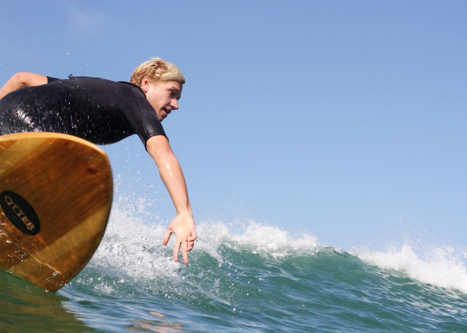 Otter wooden surfboard wave surfer