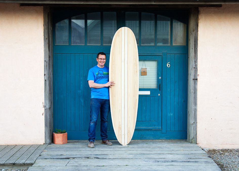 otter wooden surfboard workshop blue doors