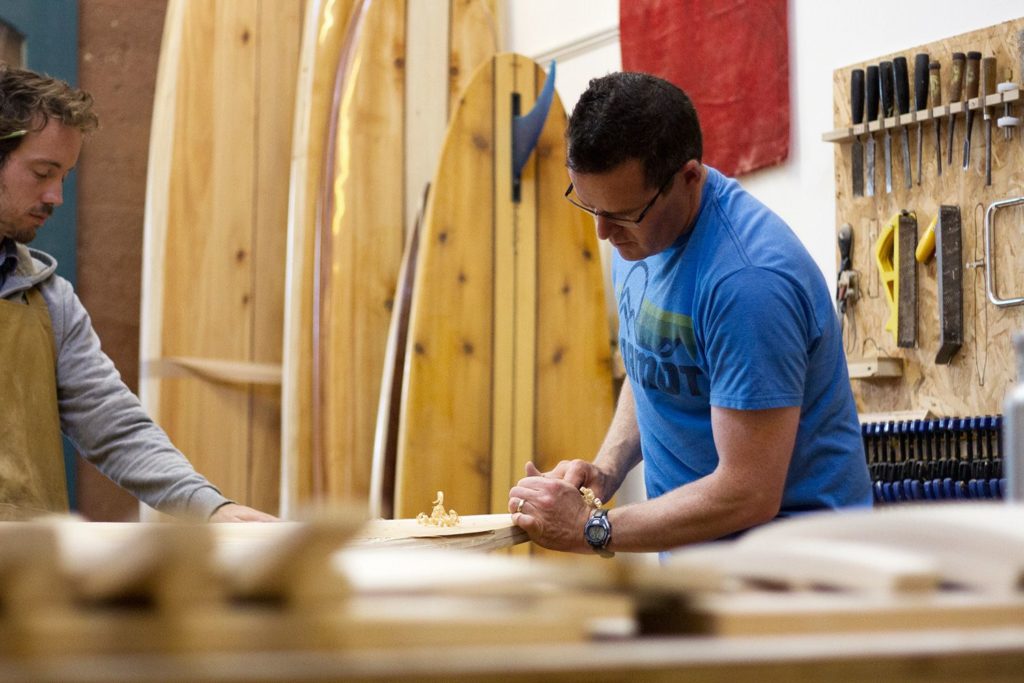 otter wooden surfboard workshop shaping