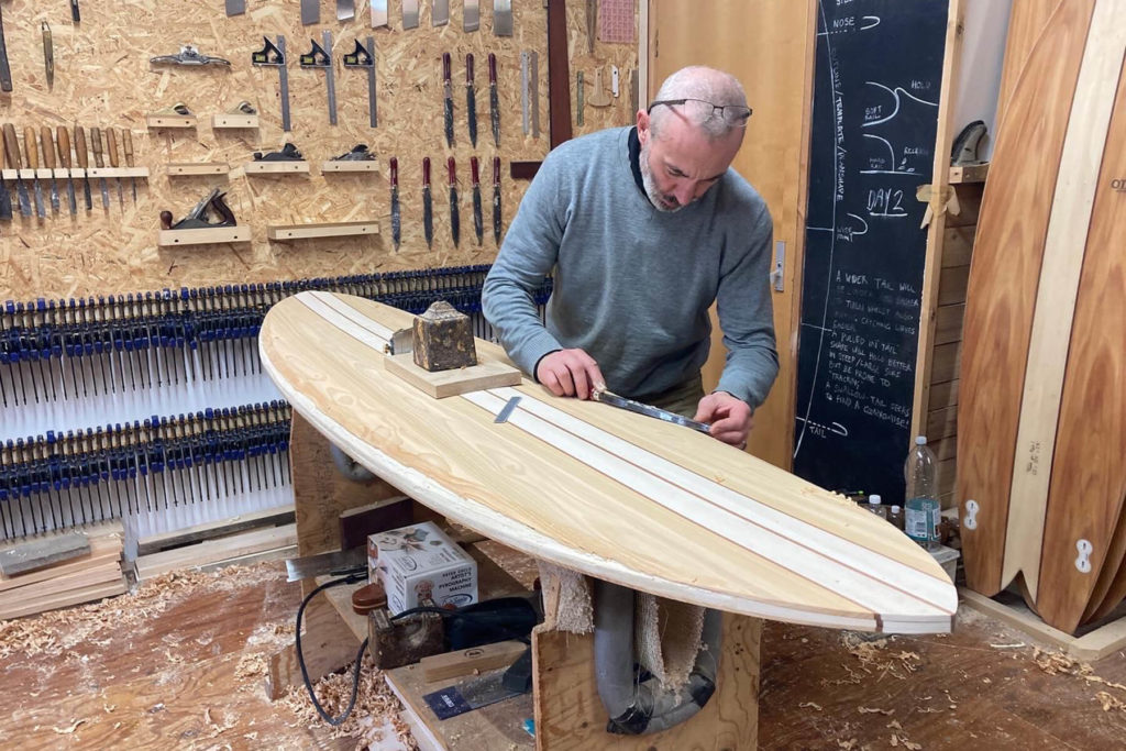 otter wooden surfboard workshop shaping