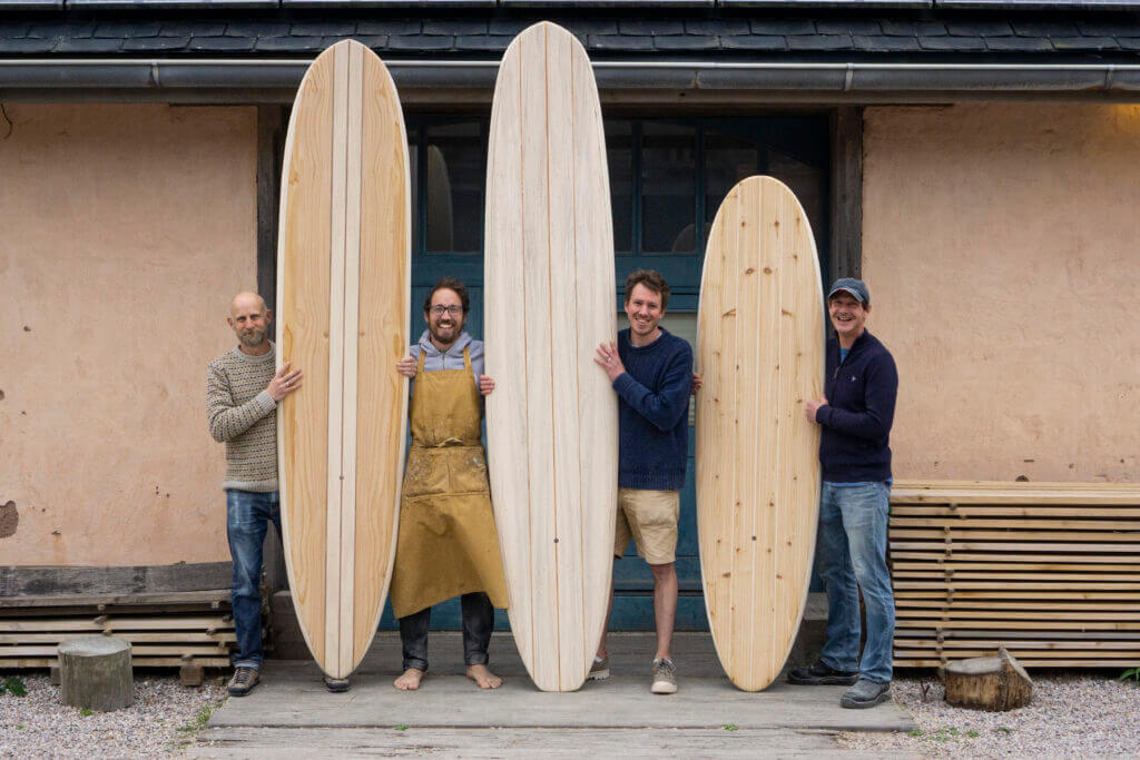 otter wooden surfboard blue doors