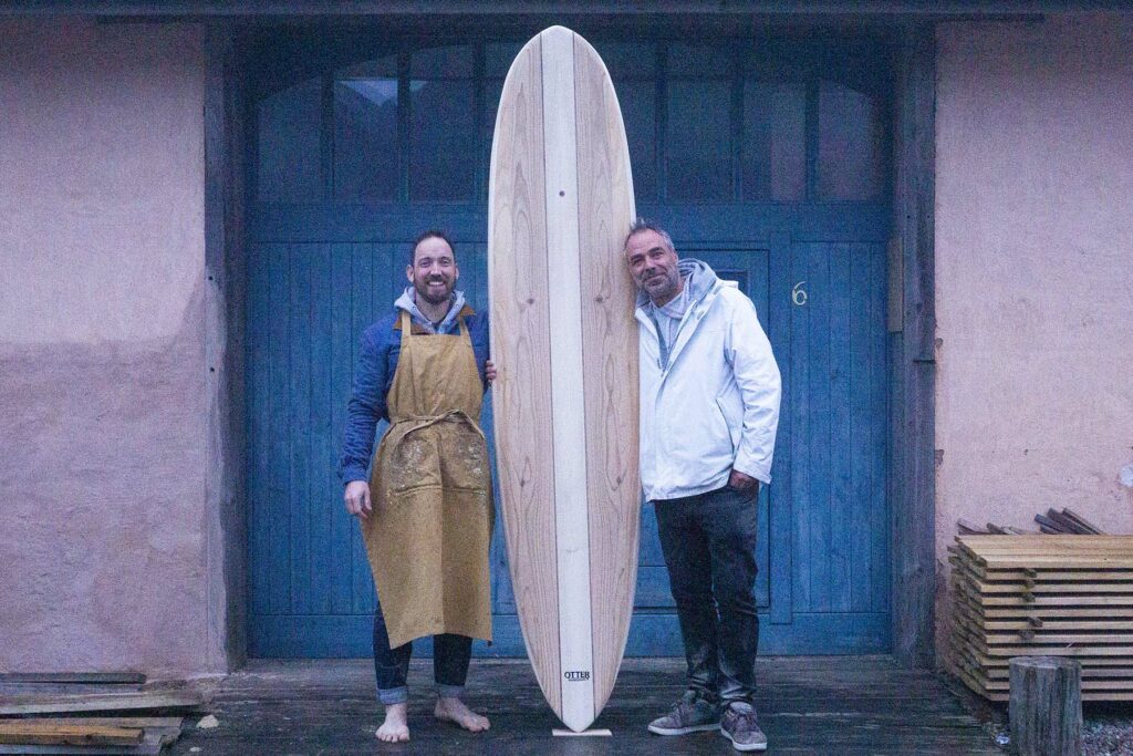 otter wooden surfboards workshop blue doors