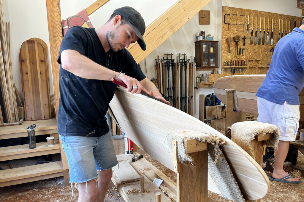 otter wooden surfboard workshop shaping