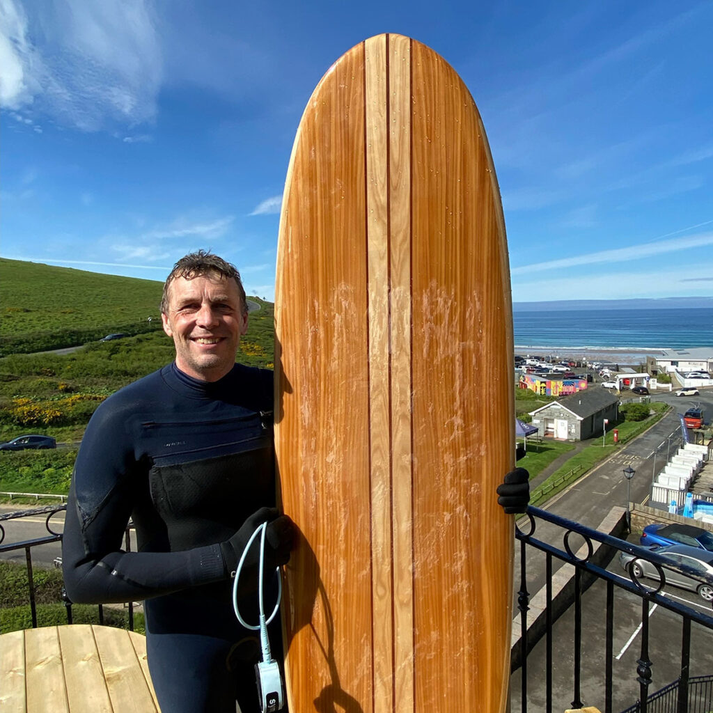 otter wooden surfboards surfer