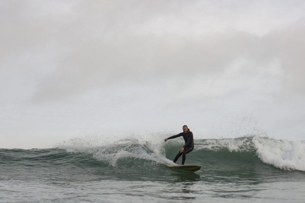otter wooden surfboards surfer wave turn