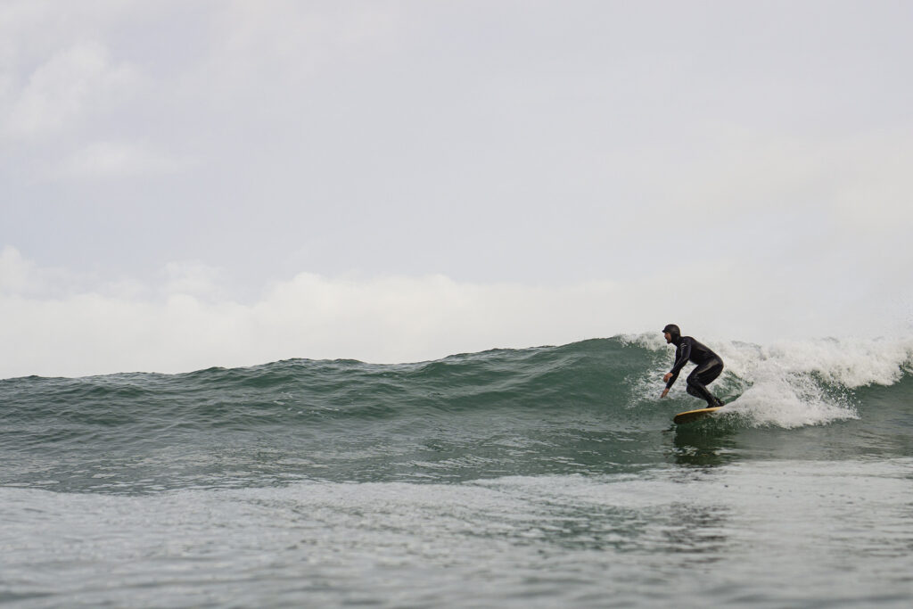 otter wooden surfboards surfer wave turn